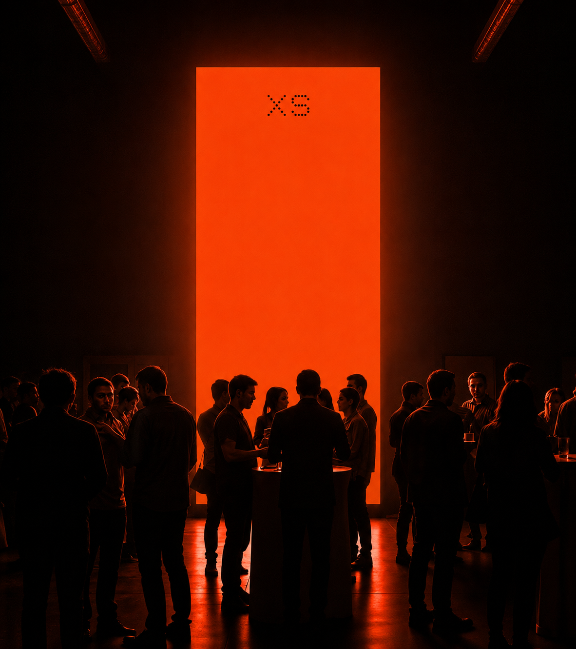 Guests gathered before an XS orange light wall